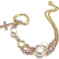 Gold and pink cross bracelet