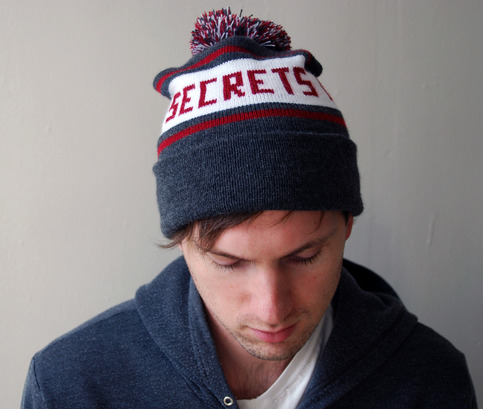 SECRETS UP TO HERE Hat with Pom